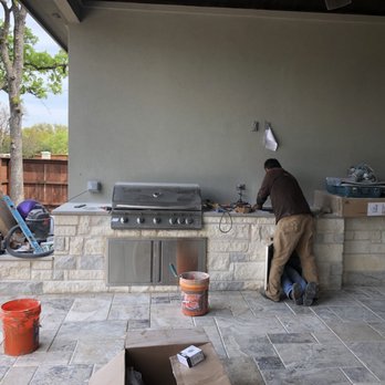 Well Grounded Landscapes - a man working on an outdoor kitchen - Landscaping Near Me - Cedar Park, Texas Well Grounded Landscapes - a man working on an outdoor kitchen - Landscaping Near Me - Cedar Park, Texas
