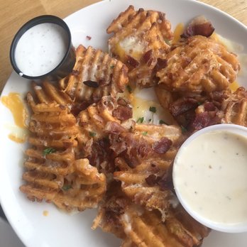 Applebee's Grill + Bar - Waffle fries appetizer with bacon bits and melted cheese - Sports Bars Near Me - Grand Forks, North Dakota Applebee's Grill + Bar - Waffle fries appetizer with bacon bits and melted cheese - Sports Bars Near Me - Grand Forks, North Dakota
