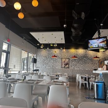 Ocean and Flame - Hanging lights on the ceiling and a modern styled wall. - Peruvian Near Me - Pinecrest, Florida Ocean and Flame - Hanging lights on the ceiling and a modern styled wall. - Peruvian Near Me - Pinecrest, Florida