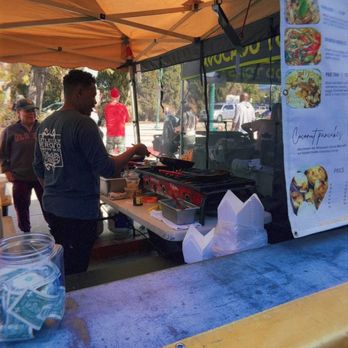 Thai Chef Saranya - Skilled chef making someone's rice plate - Caterers Near Me Thai Chef Saranya - Skilled chef making someone's rice plate - Caterers Near Me