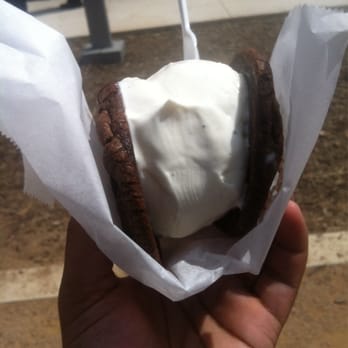 Coolhaus - Double chocolate cookie with vanilla bean ice cream presented by an edible wrap. - Street Vendors Near Me Coolhaus - Double chocolate cookie with vanilla bean ice cream presented by an edible wrap. - Street Vendors Near Me