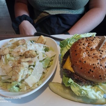 Yard House - Cheeseburger and side salad with Caesar dressing added already 06/12/2022 - New American Near Me - Dallas, Texas Yard House - Cheeseburger and side salad with Caesar dressing added already 06/12/2022 - New American Near Me - Dallas, Texas