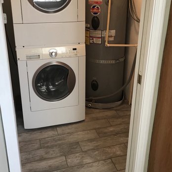 Rapid Restoration & Remodel - AFTER: water heater with new connection & porcelain tile floor - Damage Restoration Near Me - Clackamas, Oregon Rapid Restoration & Remodel - AFTER: water heater with new connection & porcelain tile floor - Damage Restoration Near Me - Clackamas, Oregon