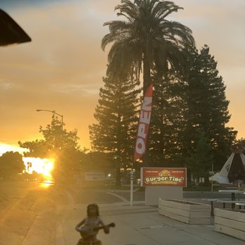 Burger Time - the sun setting behind a palm tree - Burgers Near Me - Merced, California