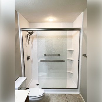 Expo Home Improvement - This bright and open walk-in shower design is in style "Alabaster White" in pattern "Random Stone." - General Contractors Near Me - Georgetown, Texas Expo Home Improvement - This bright and open walk-in shower design is in style "Alabaster White" in pattern "Random Stone." - General Contractors Near Me - Georgetown, Texas