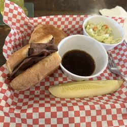The Cotter Pin - French dip roast beef sandwich with coleslaw and a pickle