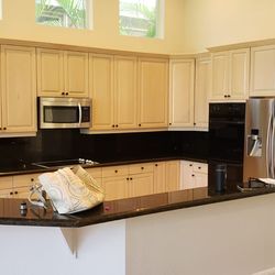 Astro Painting Services - Kitchen Cabinets before being refinished.
