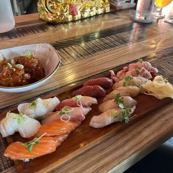 Iza Whiskey & Eats - The best nigiri assortment you can find! Chicken wings on the top left! Peep that beautiful fish! - Sushi Bars Near Me - Carrboro, North Carolina