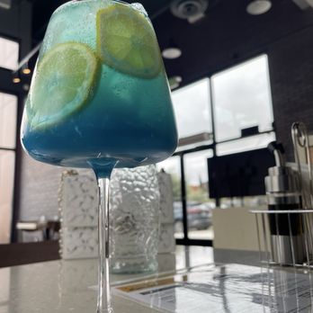 Glasshouzz - Blue lagoon spritz (mocktail) - Pizza Near Me - Livermore, California Glasshouzz - Blue lagoon spritz (mocktail) - Pizza Near Me - Livermore, California
