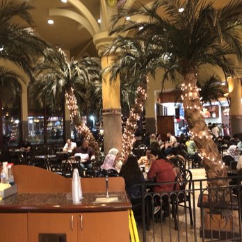 Shatila Bakery - Dearborn - interior: seating surrounded by palm trees - Desserts Near Me - Dearborn, Michigan Shatila Bakery - Dearborn - interior: seating surrounded by palm trees - Desserts Near Me - Dearborn, Michigan