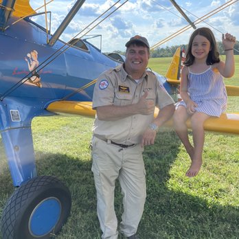 Flying Circus Air Shows - Pilot with happy spectator - Performing Arts Near Me - Bealeton, Virginia Flying Circus Air Shows - Pilot with happy spectator - Performing Arts Near Me - Bealeton, Virginia