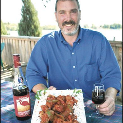 Sand Lake Party Store - Owner, Shawn Fabian, showing his favorite, Shawn's Simmered Sausage in Tomato Gravy