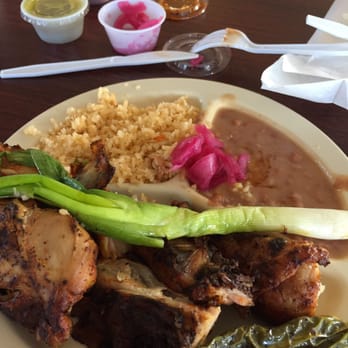 Pollo Feliz - a plate of food on a table - Mexican Near Me - Greeley, Colorado