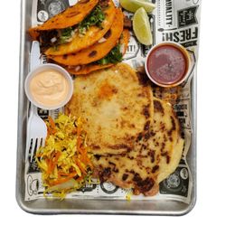El Sitio - combination of quesabirrias and pupusas stuffed with pork with cheese, chipotle sauce, tomato sauce and coleslaw