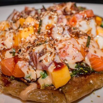 Umi 2 - Sushi pizza 12.95 really fulfilling appitizer mix with salmon,tuna , and white fish with seaweed ,mango etc on a scallion pancake reallygood - Japanese Near Me - New Orleans, Louisiana Umi 2 - Sushi pizza 12.95 really fulfilling appitizer mix with salmon,tuna , and white fish with seaweed ,mango etc on a scallion pancake reallygood - Japanese Near Me - New Orleans, Louisiana