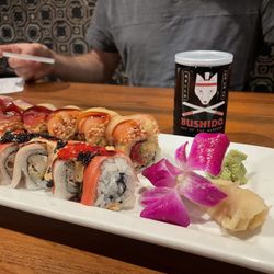 The Sushi Room - Sake ( Bushido ) in container.  Love you Long Time Vern Roll ( back )  Alcatraz Roll ( front )