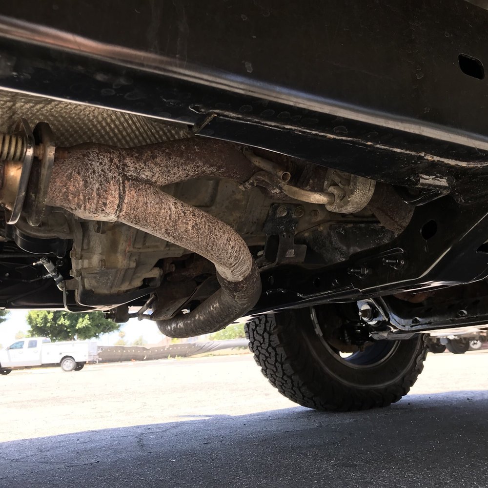 Gene's Muffler & Lara's Muffler - Before, hangs below frame cross member. - Auto Repair Near Me - Downey, California Gene's Muffler & Lara's Muffler - Before, hangs below frame cross member. - Auto Repair Near Me - Downey, California