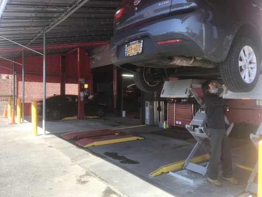 New Diagnostic Center - Our new diagnostic center was designed to improve upon the existing workspace outside. We added two low profile scissor lifts that we use for both diagnostic work and quick service (oil change, tire rotation, etc.) Additionally we added a heavy 12,000lb Rotary lift so we can better service commercial vans such as Ford Transits and Nissan NV. We removed the small old awning and added a large awning that covers the entire side of the building. We added commercial heating so that we can continue to use this space year round and better serve our customers.