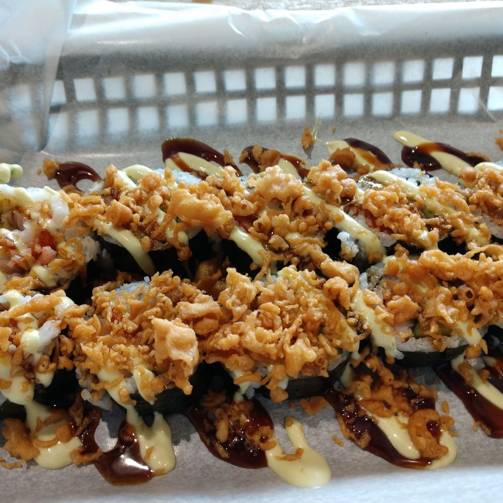 Craft Sushi - California roll with a couple of sauces and crunchy bits on top. - Sushi Bars Near Me - Springfield, Missouri