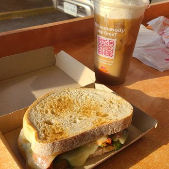 Dunkin' - a sandwich and a drink on a table - Donuts Near Me - Newport News, Virginia Dunkin' - a sandwich and a drink on a table - Donuts Near Me - Newport News, Virginia