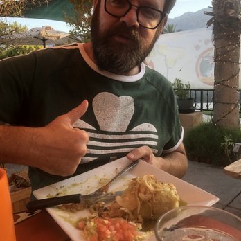 Felipe's - My hubs chowing down his burrito. - Mexican Near Me - Palm Springs, California