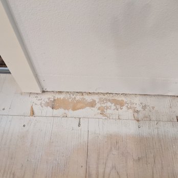 S W Contractors - Drywall compound on the subfloor that the installer carefully took the time to scrap away before installing the new floor - Flooring Near Me - Vancouver, Washington S W Contractors - Drywall compound on the subfloor that the installer carefully took the time to scrap away before installing the new floor - Flooring Near Me - Vancouver, Washington