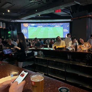 La Cage - Biggest screen to watch your favorite soccer team! - Sports Bars Near Me - Montreal, Quebec