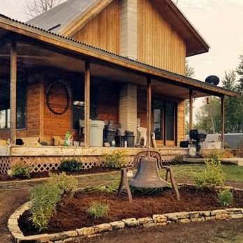 R406 Contracting - the front of a house with a bell in the yard - Landscaping Near Me - Kalispell, Montana R406 Contracting - the front of a house with a bell in the yard - Landscaping Near Me - Kalispell, Montana