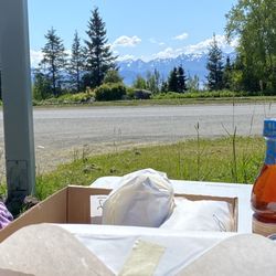 Fritz Creek General Store - The "lawn" that is patches of weeds, dirt & rocks. Big sandwich, great bread, blah sandwich and horrible customer service!