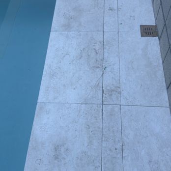 Teserra - Damaged limestone pavers during Teserra's install - Landscaping Near Me - Palm Desert, California