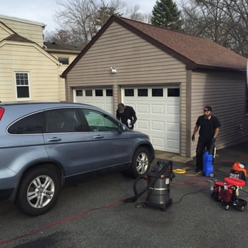 Illusionz Mobile Auto Spa - Brandon and his partner at work. - Auto Detailing Near Me