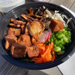 Skully's - Fresh Ramen Bowl with noodles, both Fried Tofu and Smoked sliced Pork protein and veggies plus broth on side. Yummy good!