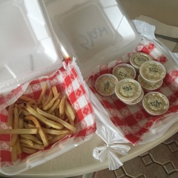 Wing N It - a tray of fries and a container of dips - Venues & Event Spaces Near Me - Hudson, Florida