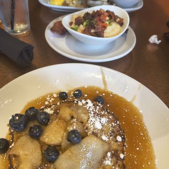 Another Broken Egg Cafe - Apple Fritter French toast, cheese grits and a lobster omelette in the background - Breakfast & Brunch Near Me - Mountain Brook, Alabama