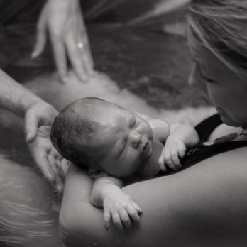 Love Warrior Birth Services - A beautiful, empowered water birth at home -- thanks to Loni & Stephanie! (Photo captured by Stephanie) - Doulas Near Me Love Warrior Birth Services - A beautiful, empowered water birth at home -- thanks to Loni & Stephanie! (Photo captured by Stephanie) - Doulas Near Me