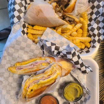 Don Lucho's Cafe - Cuban and Lomo Steak Sandwhich (green and ketchup sauce - they give you free sauce for every $5 spent... where's the other 2?) - Cuban Near Me - Coral Springs, Florida Don Lucho's Cafe - Cuban and Lomo Steak Sandwhich (green and ketchup sauce - they give you free sauce for every $5 spent... where's the other 2?) - Cuban Near Me - Coral Springs, Florida