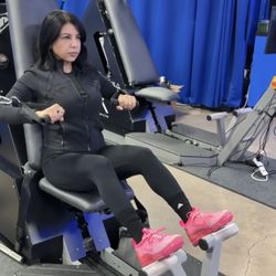 Client doing a horizontal press to work her upper body on ARX Omni