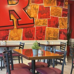 Scarlet 158 Restaurant - Dining area inside Scarlet 158 Restaurant in New Brunswick, featuring our Rutgers-inspired wall and a cozy breakfast atmosphere.