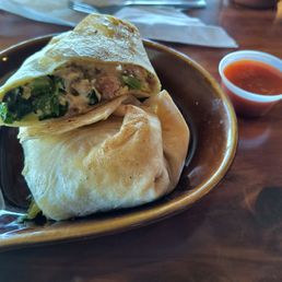 Frittata put in a wrap with tobasco on the side.