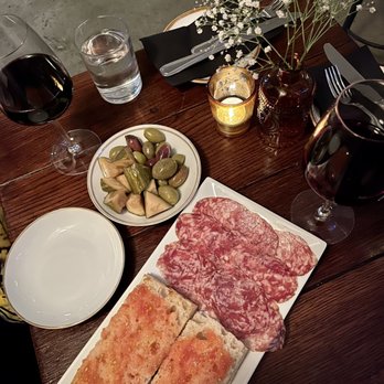 Brick Wine Bar - a plate of meat, bread, and a glass of wine - Wine Bars Near Me - New York, New York