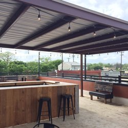 The Aumont Saloon - Rooftop patio with tv overlooking downtown Seguin