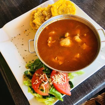 The Island - Chicken stew with fried plantain. Chicken had a weird (fish? Raw?) taste and I really had a hard time swallow it... - Puerto Rican Near Me - Aguada, Puerto Rico The Island - Chicken stew with fried plantain. Chicken had a weird (fish? Raw?) taste and I really had a hard time swallow it... - Puerto Rican Near Me - Aguada, Puerto Rico
