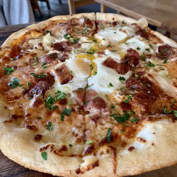 Gather - Brunch Pizza: eggs, bacon, caramelized onions, tomato sauce, potato, herbs and a yummy cheese - New American Near Me - Berkeley, California