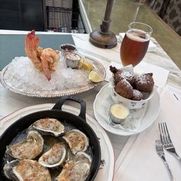 Wood-fired oysters, crab hush puppies and shrimp cocktail Wood-fired oysters, crab hush puppies and shrimp cocktail