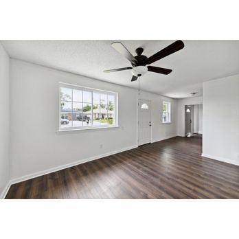 La Pro Construction - an empty room with a ceiling fan - General Contractors Near Me