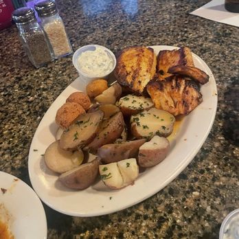 Mikee's Seafood - Blackened mahi with new potatoes corn fritters and hush puppies - Seafood Near Me - Gulf Shores, Alabama Mikee's Seafood - Blackened mahi with new potatoes corn fritters and hush puppies - Seafood Near Me - Gulf Shores, Alabama