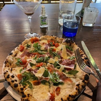 Facci Ristorante - a pizza on a plate with a fork and knife - Italian Near Me - Laurel, Maryland Facci Ristorante - a pizza on a plate with a fork and knife - Italian Near Me - Laurel, Maryland