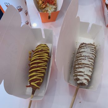 Two hands Corn Dogs -Kennesaw - American original with sausage (left) and the two hands original with the mozzarella (right) - Fast Food Near Me - Kennesaw, Georgia