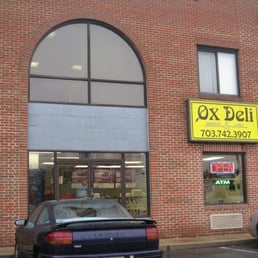 a car parked in front of a store a car parked in front of a store
