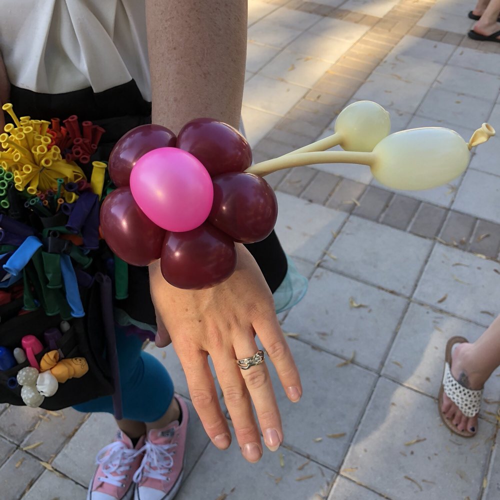 Balloons With A Twist - She made a flower bracelet! - Face Painting Near Me Balloons With A Twist - She made a flower bracelet! - Face Painting Near Me